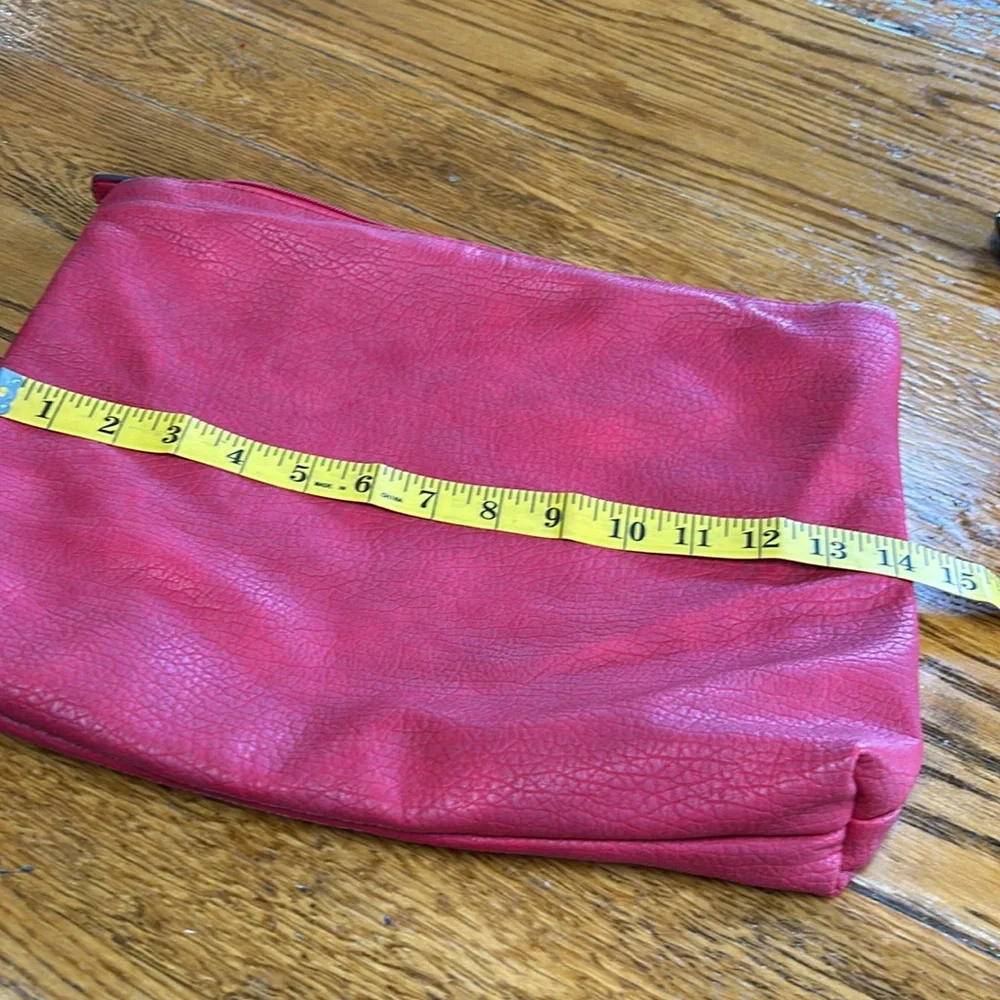 Free People red faux pebble leather travel zip bag.  Red. Approximately 11”X14”.